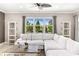 Comfortable living room with large window, white sectional sofa, and stylish decor at 12173 Aztec Rose Ln, Orlando, FL 32827