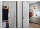 Bedroom view from closet with ceiling fan, window, dresser and bed at 13234 Moonflower Ct, Clermont, FL 34711