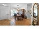 Formal dining room featuring a chandelier, a large window, and elegant decor for memorable gatherings at 13234 Moonflower Ct, Clermont, FL 34711