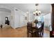 Elegant dining room with a chandelier and a dining table that seats six, ideal for Gathering meals at 13234 Moonflower Ct, Clermont, FL 34711