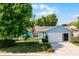 Beautiful one-story home with a well-kept lawn, large shade tree, and a convenient two-car garage at 13234 Moonflower Ct, Clermont, FL 34711