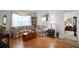 Inviting living room featuring laminate floors and comfortable seating, creating a warm and welcoming ambiance at 13234 Moonflower Ct, Clermont, FL 34711