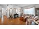 Spacious living room with laminate flooring, neutral walls, and plenty of natural light at 13234 Moonflower Ct, Clermont, FL 34711
