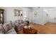 Bright living room showcasing laminate floors and an open layout, perfect for entertaining or relaxing at home at 13234 Moonflower Ct, Clermont, FL 34711