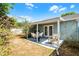 A covered patio with outdoor furniture and a view of the backyard at 13234 Moonflower Ct, Clermont, FL 34711