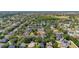 An aerial view of the property in a neighborhood featuring ponds and lots of trees at 13247 Hatherton Cir, Orlando, FL 32832