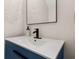 Modern bathroom featuring a sleek vanity with a white countertop and black fixtures at 13247 Hatherton Cir, Orlando, FL 32832