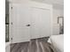 Bedroom featuring wood-look floors, neutral walls, and a closet and dresser at 13247 Hatherton Cir, Orlando, FL 32832