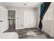 This bedroom features wood floors, a double door closet, and natural light at 13247 Hatherton Cir, Orlando, FL 32832