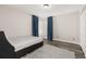 Bedroom with wood-look floors, neutral walls, blue accents, and closet at 13247 Hatherton Cir, Orlando, FL 32832