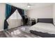 Bedroom with workstation, wood-look floors, neutral walls, ceiling fan, and natural light at 13247 Hatherton Cir, Orlando, FL 32832