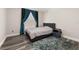 This bedroom features wood floors, a large window, and stylish decor at 13247 Hatherton Cir, Orlando, FL 32832