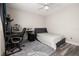 Bedroom with workstation, wood-look floors, neutral walls, and bright natural light at 13247 Hatherton Cir, Orlando, FL 32832