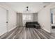 An upstairs bonus room is complete with a modern ceiling light and laminate flooring at 13247 Hatherton Cir, Orlando, FL 32832