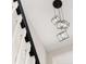 Stylish modern chandelier hangs near a staircase with dark wood and white spindles at 13247 Hatherton Cir, Orlando, FL 32832