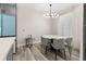 Elegant dining room with a modern table, stylish chairs, and bright natural light at 13247 Hatherton Cir, Orlando, FL 32832