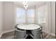Elegant dining room with a modern table, stylish chairs, and bright natural light at 13247 Hatherton Cir, Orlando, FL 32832
