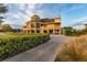 Stunning multi-story building with stone accents, balconies, and turret, surrounded by manicured landscaping at 13247 Hatherton Cir, Orlando, FL 32832