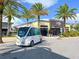 Stylish building with a modern design, complemented by palm trees and a self driving shuttle bus in front at 13247 Hatherton Cir, Orlando, FL 32832