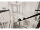Grand foyer with staircase, modern chandelier, and a view of the entrance at 13247 Hatherton Cir, Orlando, FL 32832