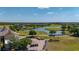 View of the golf course, pond and club house in the community on a sunny day at 13247 Hatherton Cir, Orlando, FL 32832