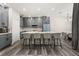 Spacious kitchen featuring gray cabinetry, large island and stainless steel appliances at 13247 Hatherton Cir, Orlando, FL 32832