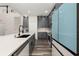 Modern kitchen featuring gray cabinetry, quartz countertops, and blue refrigerator at 13247 Hatherton Cir, Orlando, FL 32832