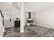 Open living room with wood floors, a staircase, and a large window at 13247 Hatherton Cir, Orlando, FL 32832