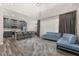 Open living space with breakfast bar, pendant lights, and comfortable blue sofa at 13247 Hatherton Cir, Orlando, FL 32832