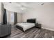Spacious main bedroom with stylish furniture, a ceiling fan, and large windows with elegant curtains at 13247 Hatherton Cir, Orlando, FL 32832