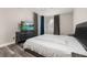 Spacious main bedroom with stylish furniture, a ceiling fan, and large windows with elegant curtains at 13247 Hatherton Cir, Orlando, FL 32832
