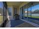 This screened patio overlooks the green backyard, great for relaxing at 13247 Hatherton Cir, Orlando, FL 32832