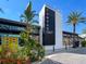 Modern 'Canvas' restaurant and market building, adorned with artistic decor and lush landscaping at 13247 Hatherton Cir, Orlando, FL 32832