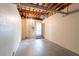 Unfinished basement area with block walls and concrete floor, ready for customization at 1411 N Powers Dr, Orlando, FL 32818