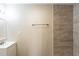 Neutral toned bathroom with tile shower, modern vanity, and new fixture at 1411 N Powers Dr, Orlando, FL 32818