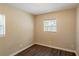 Bedroom with wood floors, window with natural light, and neutral paint at 1411 N Powers Dr, Orlando, FL 32818