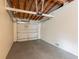 Spacious one car garage with an automatic garage door and concrete flooring at 1411 N Powers Dr, Orlando, FL 32818