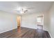 Inviting living room with ceiling fan, modern laminate flooring, and neutral wall paint at 1411 N Powers Dr, Orlando, FL 32818