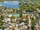 Aerial view of a property near the lake and community tennis and pool at 1450 Harbour Dr, Longwood, FL 32750