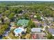 Areal view of the community pool and tennis court, lake, and lush landscaping at 1450 Harbour Dr, Longwood, FL 32750