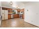 Spacious kitchen featuring wooden cabinets, stainless steel appliances, and tile floor at 1450 Harbour Dr, Longwood, FL 32750