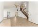 Open floor plan with tile floor, grand staircase and statement lighting, bathed in natural light at 1450 Harbour Dr, Longwood, FL 32750