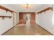 Spacious living room includes tile floors, built-in wood shelves, and neutral wall colors at 1450 Harbour Dr, Longwood, FL 32750