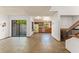 Bright room featuring sliding glass door, window with storage, kitchen and tile floor at 1450 Harbour Dr, Longwood, FL 32750