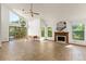 Open concept living room featuring tile floors, fireplace, and large windows at 1450 Harbour Dr, Longwood, FL 32750