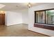 Living room featuring large windows, tile floor and garden view at 1450 Harbour Dr, Longwood, FL 32750