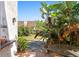 Private patio surrounded by lush tropical foliage, creating a serene outdoor retreat at 1450 Harbour Dr, Longwood, FL 32750