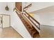 Unique staircase design with wooden accents and natural light enhances the home's architectural appeal at 1450 Harbour Dr, Longwood, FL 32750