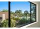 The window provides a beautiful view of the community tennis courts and landscaping at 1450 Harbour Dr, Longwood, FL 32750