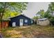 A compact backyard featuring a utility shed and a back door for convenient outdoor access at 1506 37Th St, Orlando, FL 32839